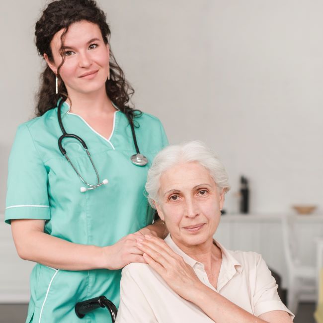 portrait female nurse with her senior patient sitting wheel chair 1