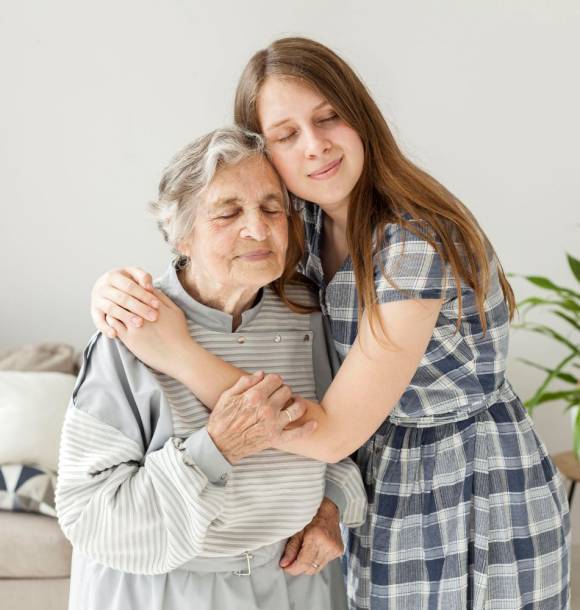 granddaughter-hugging-grandmother-with-love